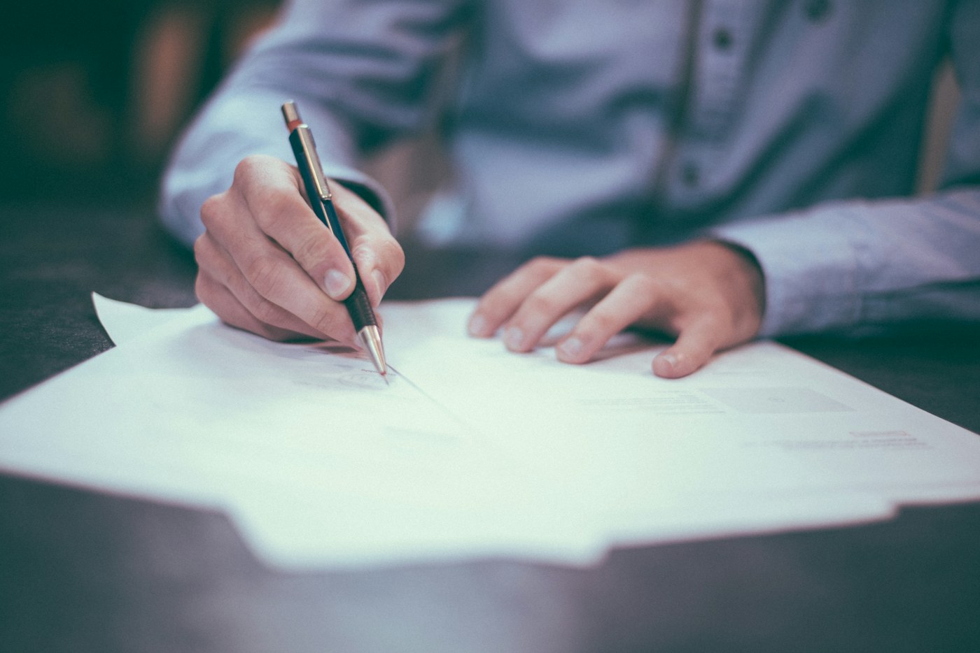 A contract and calendar being reviewed before an annual commitment