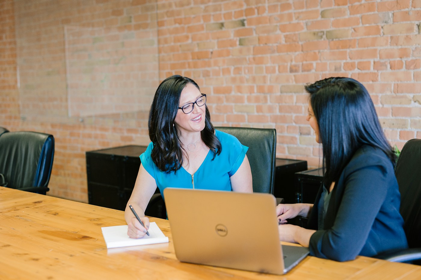 Two professionals discussing a service agreement before signing